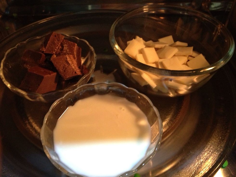 Melt the white and milk chocolate in the microwave or over a double boiler. Be careful to check every 30 seconds if using the microwave.