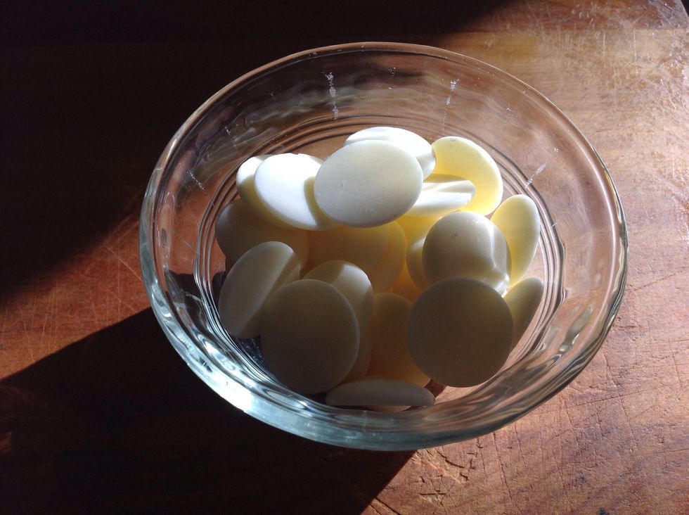Melt the white chocolate and stir in green food colouring. In a separate bowl, melt the dark chocolate and add black food colouring as needed to match the Oreo colour.
