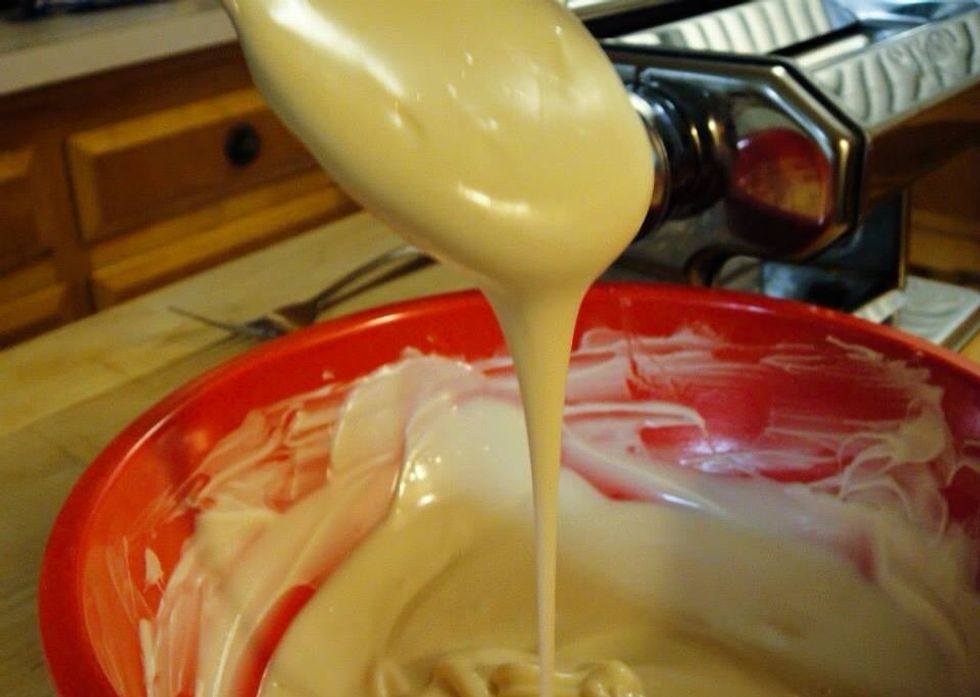 Melt white chocolate chips in a double boiler or a microwave until smooth, do not over cook it. Set the chocolate aside and allow to cool until just lukewarm.