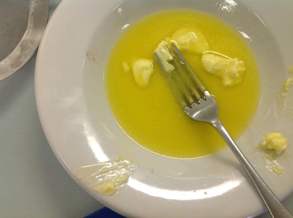 Melt your butter in a microwave or on a stove top.