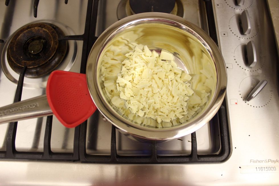 Melt your chopped up white chocolate. You can use regular chocolate or coloured candy melts instead if you want different colours for a particular design or pattern. You can also skip this whole step.