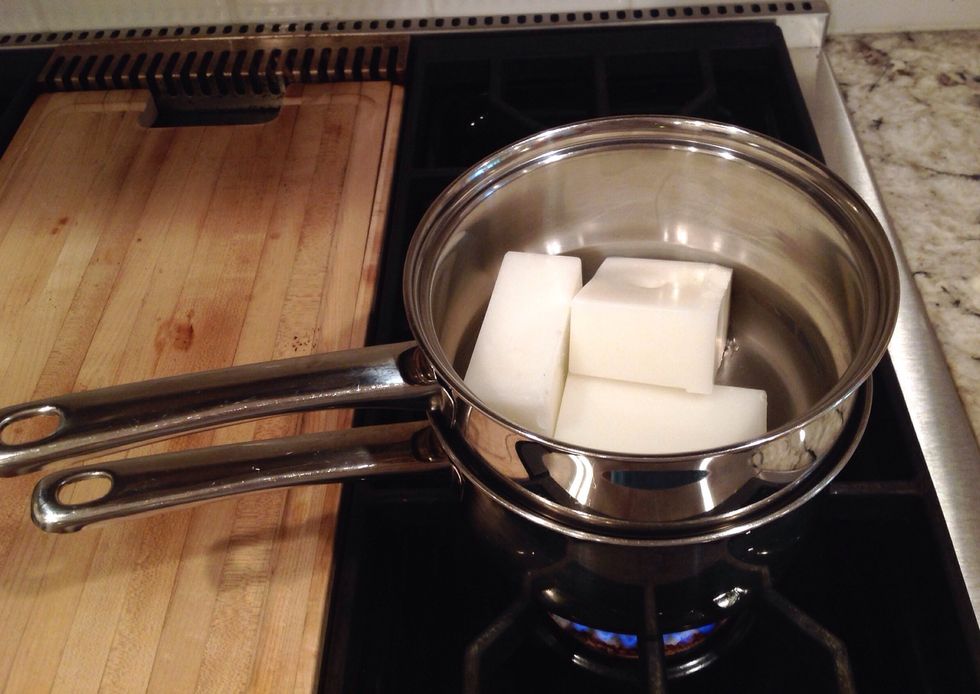 Melt your wax. You will fill the bottom pot of your double boiler with water. Place your wax in the upper pot. Allow it to melt completely as the water begins to boil.