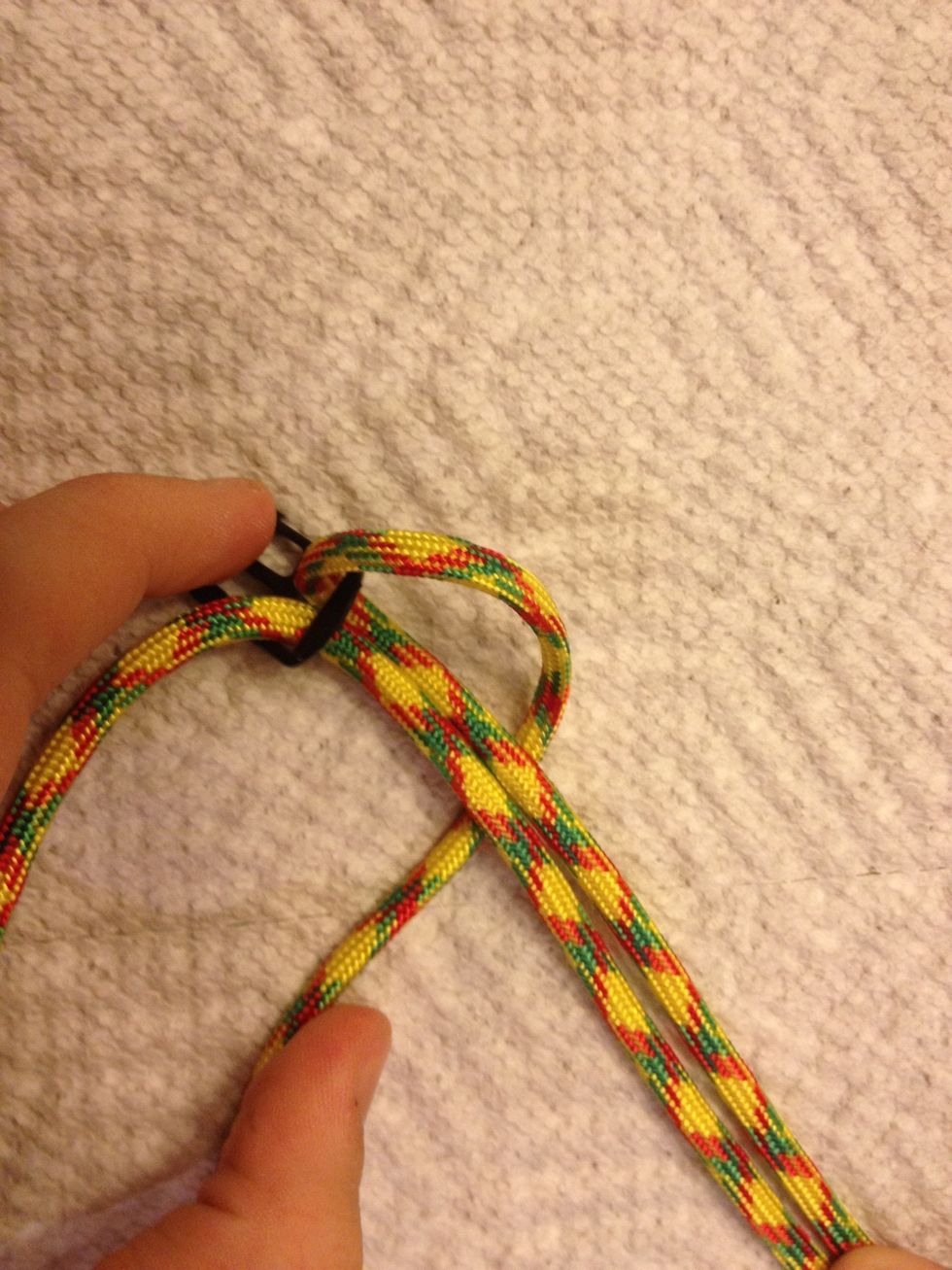 Mentally label the strings A and B NEVER forget this. Take the right sting /A and lace it under the 2 middle strings. A always goes under and B always goes over