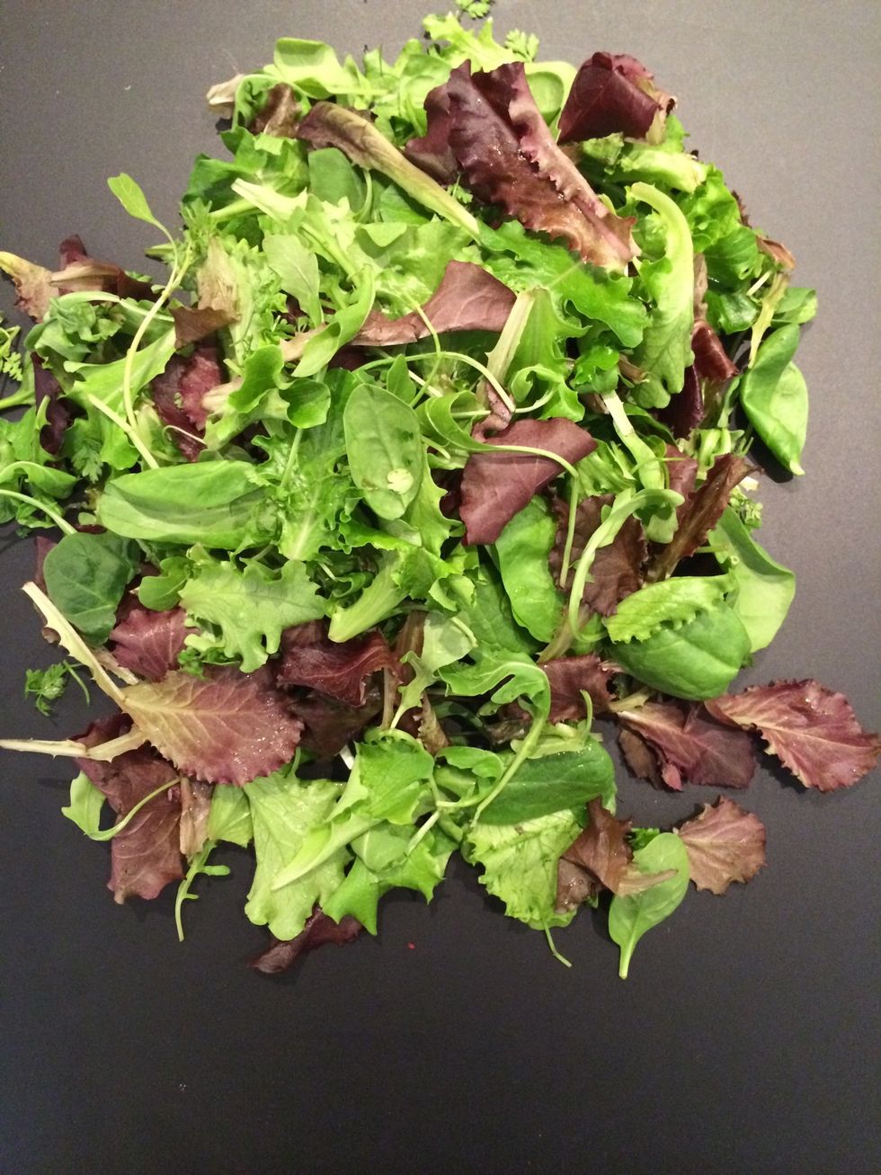 Mesclun is mixed greens sold in France. But one could put any green leaves.