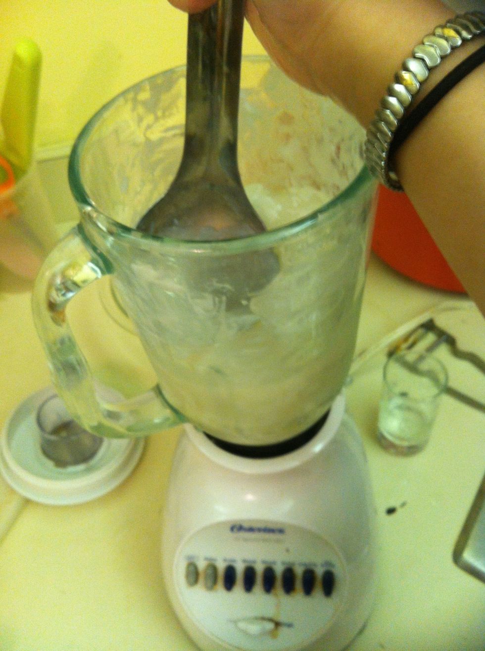 Mesh the fruits and ice cubes down with a big scoop, close lid and blend