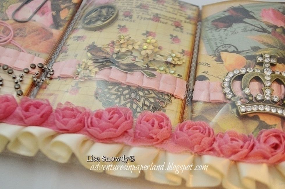 Metal charms, 3D stickers and a metal element by Finnabair add flair to this pocket. The pink pleated trim is by Stampin' Up.