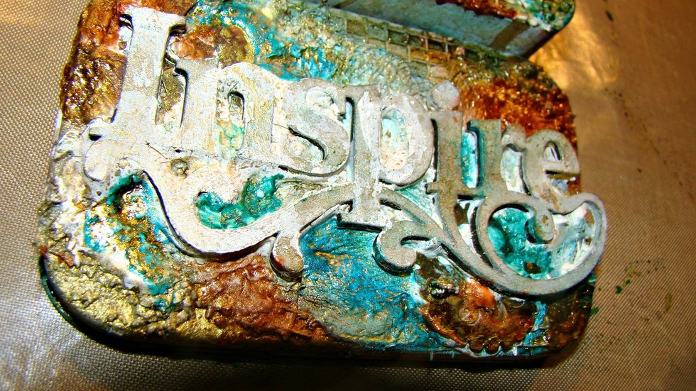 Metal Effects Gold was watered down and spritzed ontop to bring out a pretty gold sheen.