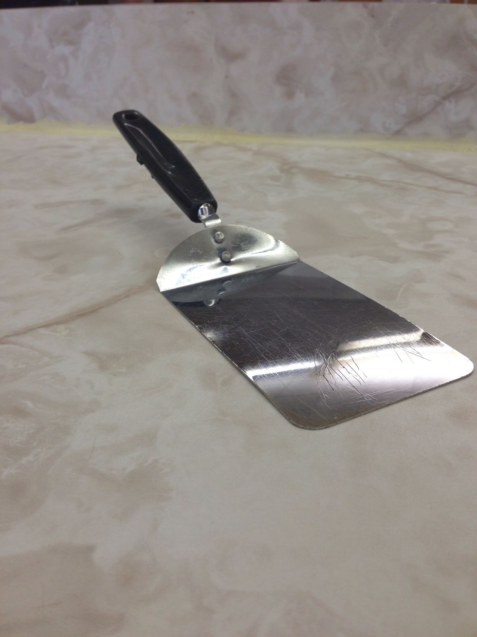 Metal spatula  This is used to mix spread or lift material  I can use this when I make pies