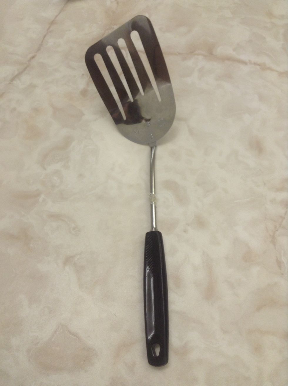 Metal Spatula. Used to scoop baked goods off of pans. I can use a metal spatula to remove cookies from a pan.