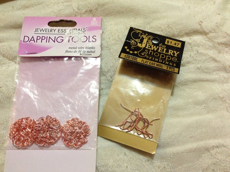Metal wire blanks (already formed into this "flower" design) & flat ear wire . I bought the wire blanks from Michael's months ago & the ear wires from Hobby Lobby. Both were on sale!!
