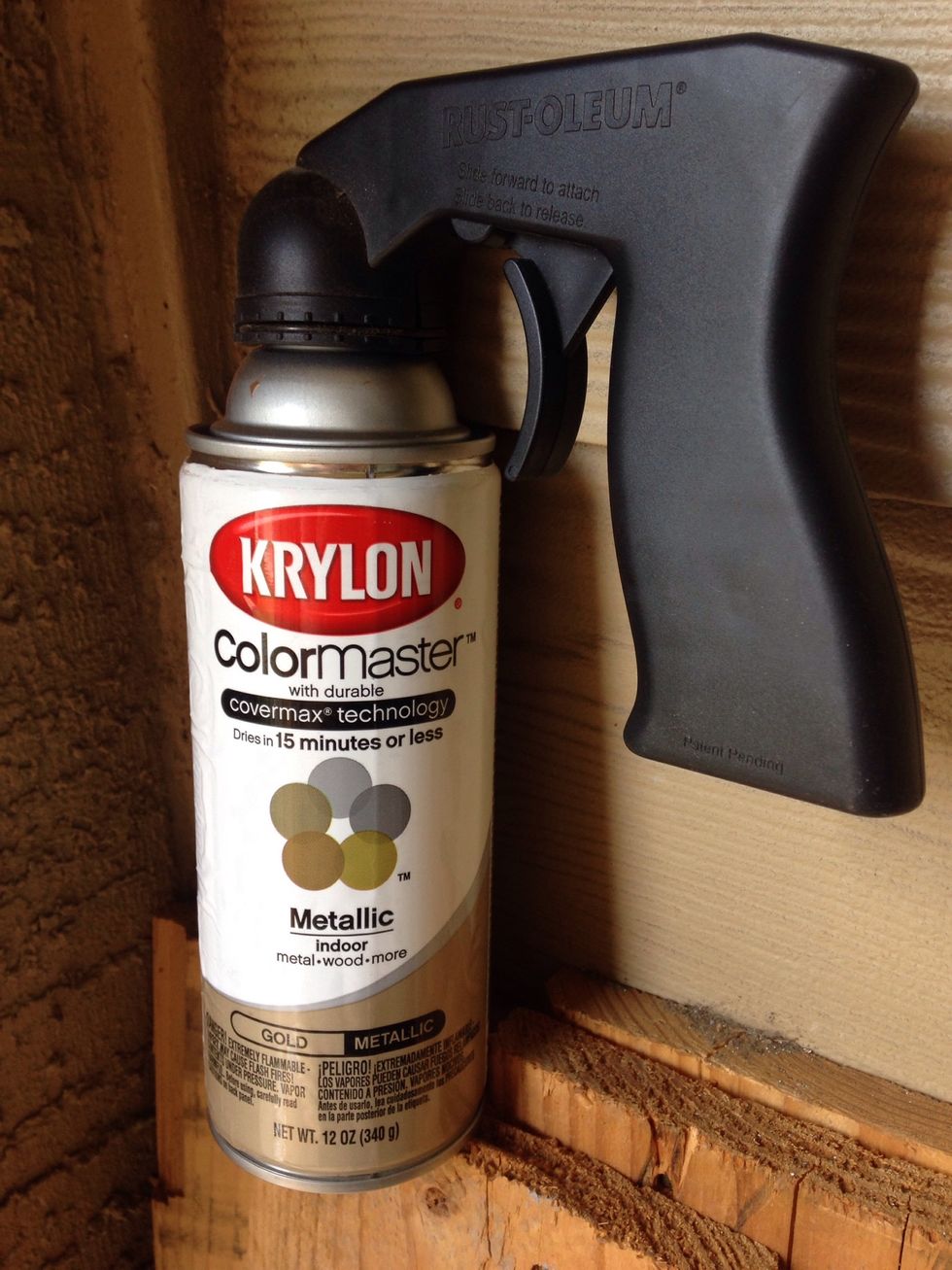 Metallic gold spray paint. I like to use the handle sprayer just so I don't get paint on my hands. I believe this was around $1.00 at Wal-Mart.