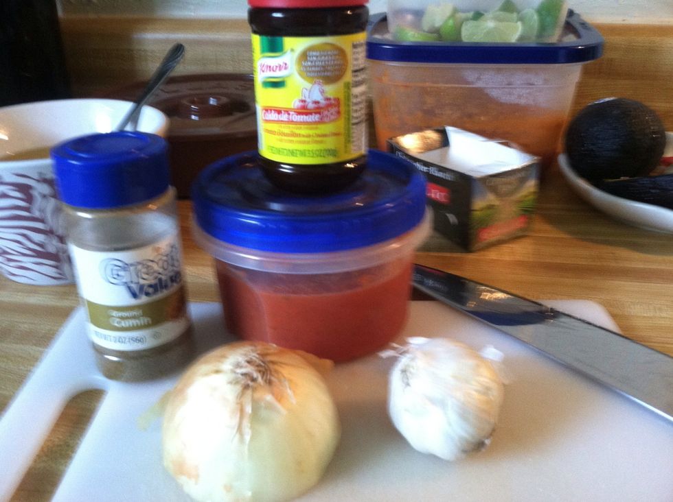 Mexican rice... Cumin, tomato sauce, garlic Clove and 1/4 of an onion.