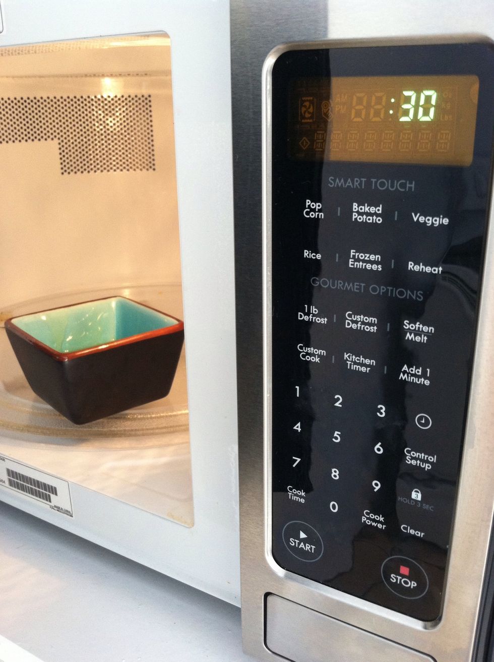Microwave for 30 seconds, take out and stir. Apply it to your hair, starting at the ends working your way up to the scalp. Clip your hair up or put it in a shower cap. Let sit for 30 minutes then wash