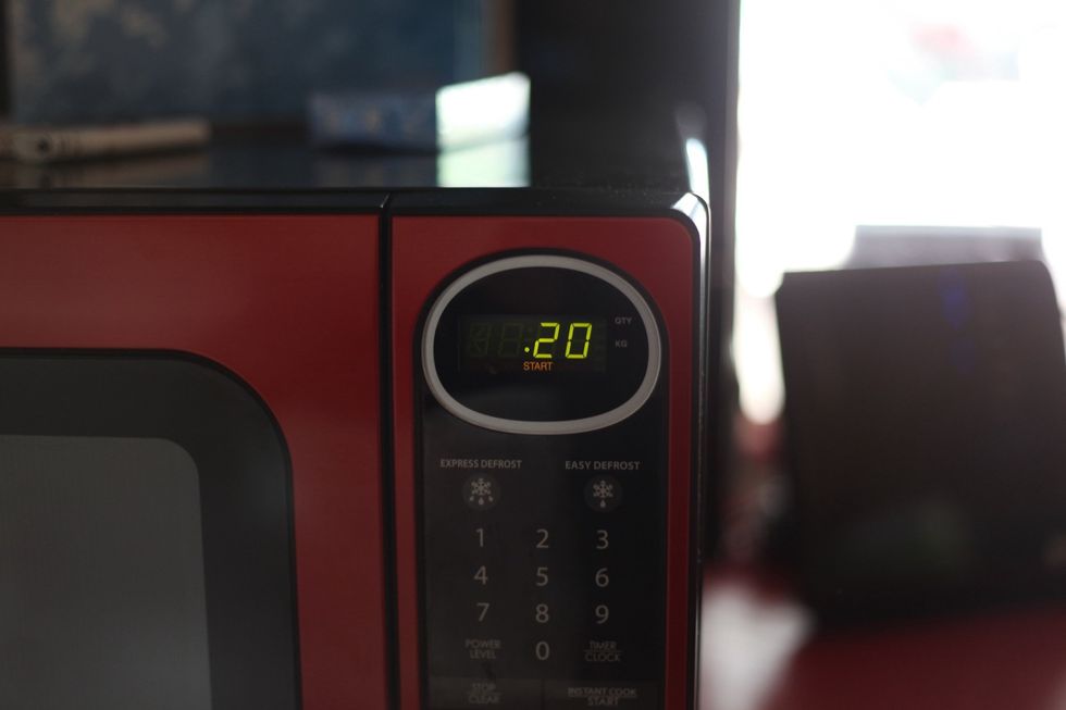 Microwave it for no more than 20-25 seconds Depending on your microwave power. If you burn the coffee, you will tell me that it's by far the worst coffee in the world!! Don't burn it please!