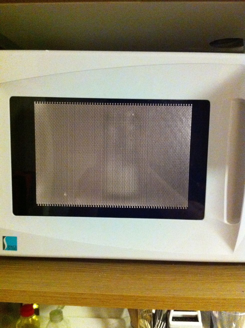 Microwave on medium power for about 10 seconds; watch it carefully as the milk is going to double in volume.