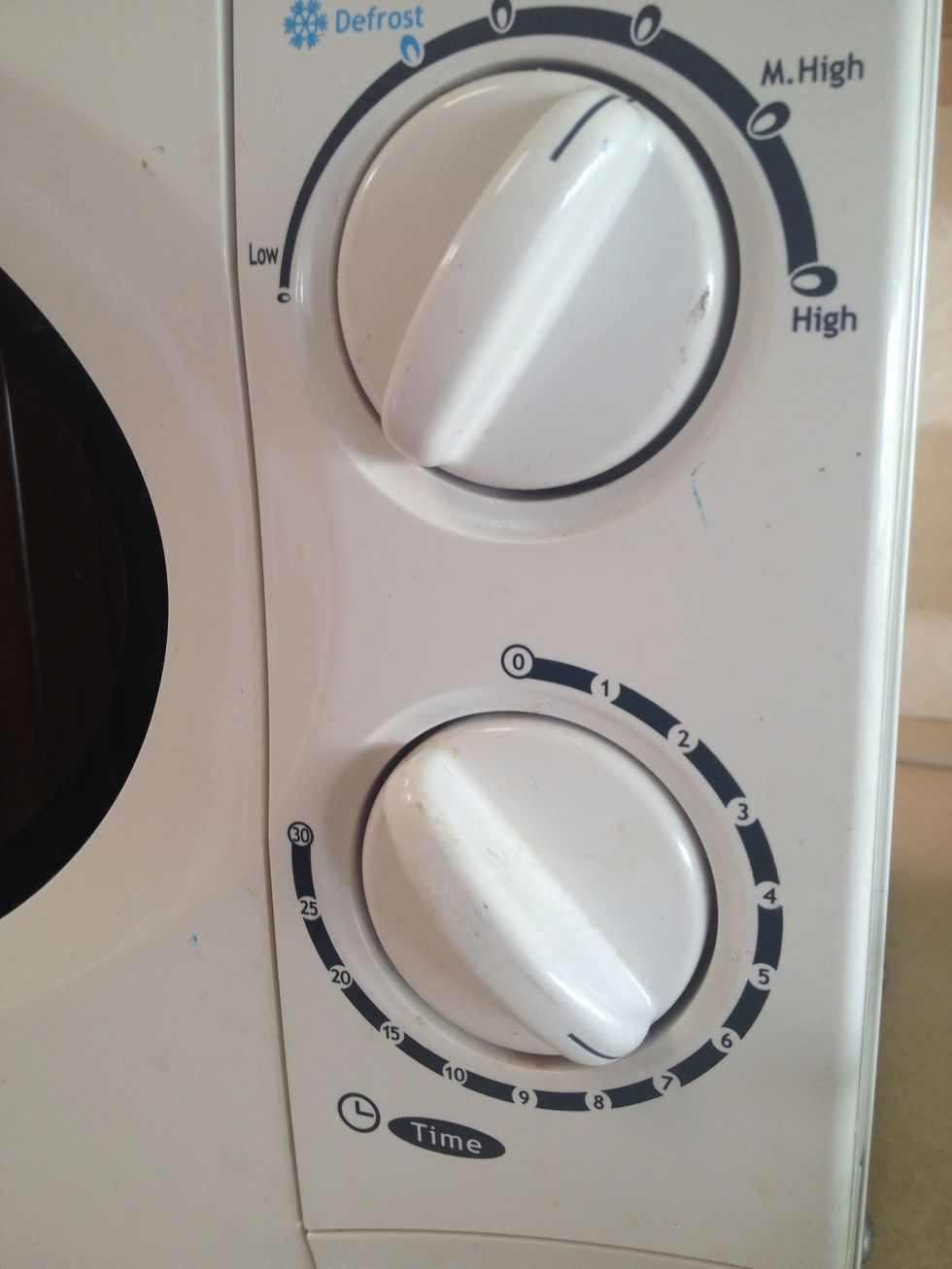 Microwave on medium (roughly 700 watt). For about 8-9 minutes for soft boiled. Or 10-12 for hard boiled.