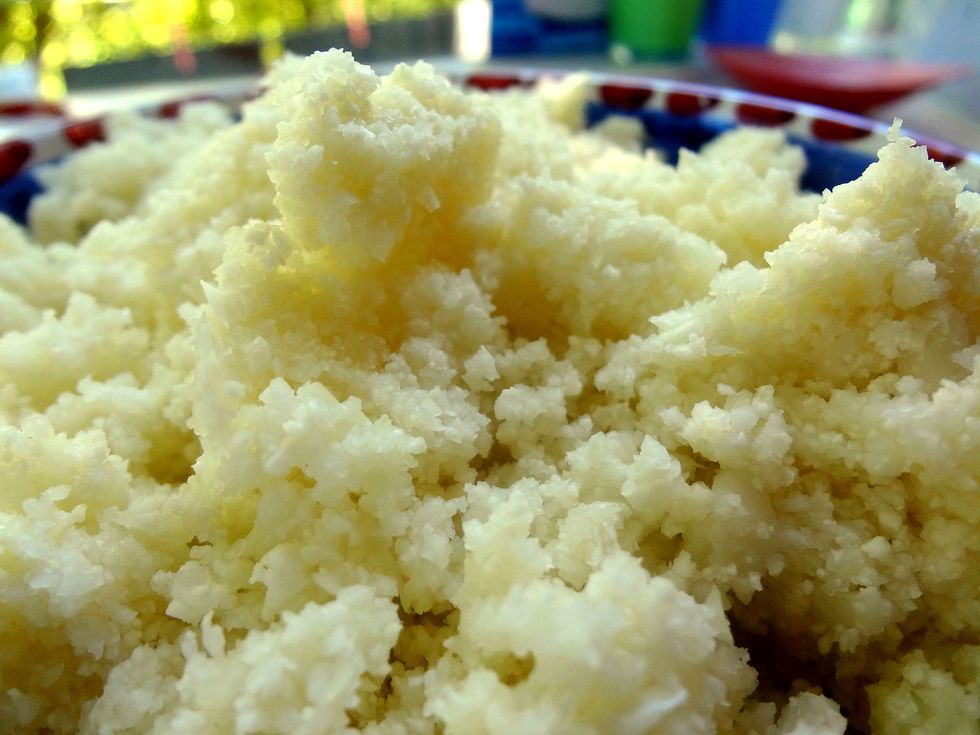 Microwave the cauliflower crumbs for 5 to 6 minutes, or until soft. You can also boil or steam the cauliflower, but excess water will need to be squeezed out.