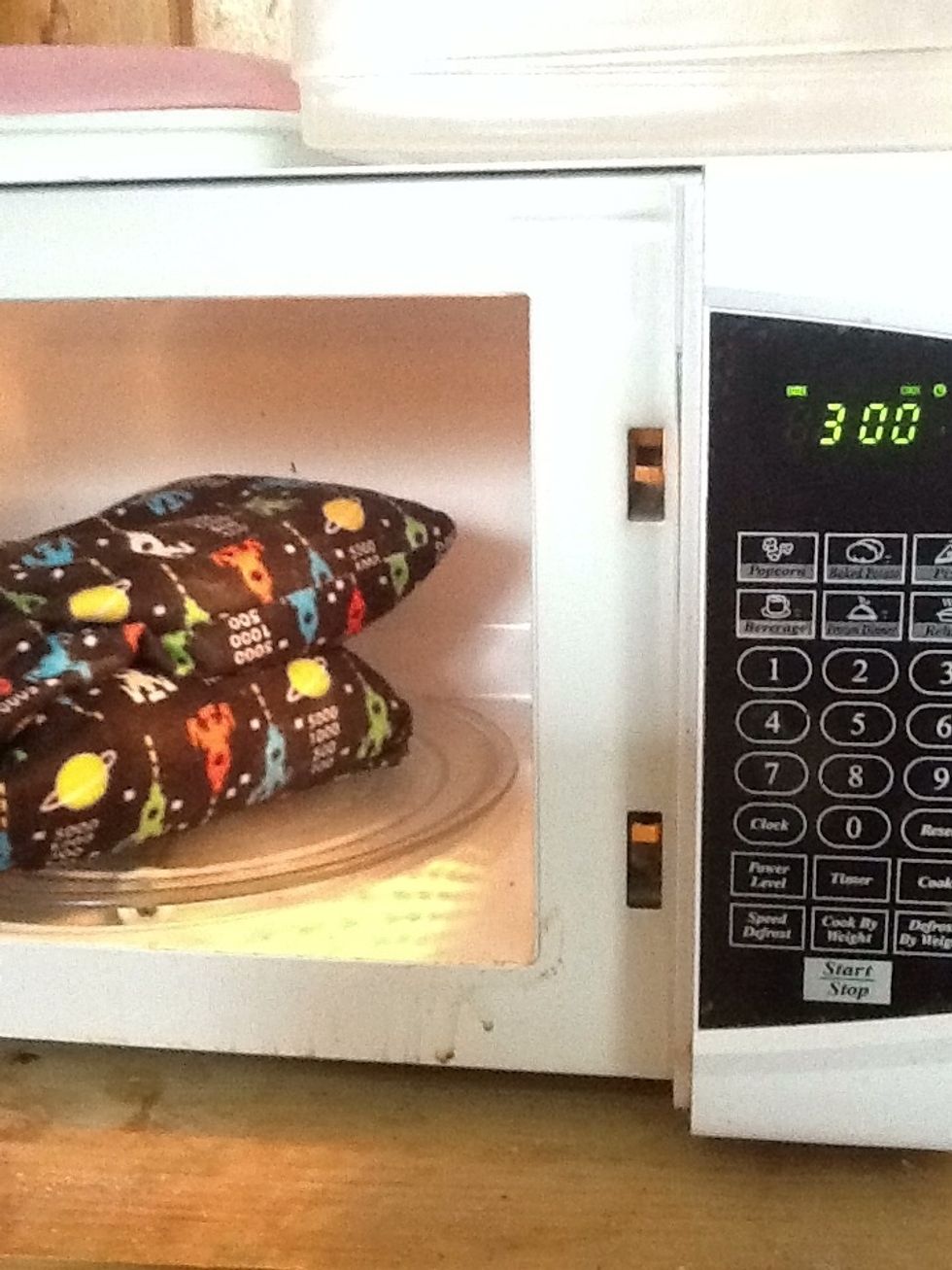 Microwave using caution. First time start with two minutes or less until you know how hot it will get. Don't give to kids or pets unless you know it's a safe temp. But assuming that's all done.....