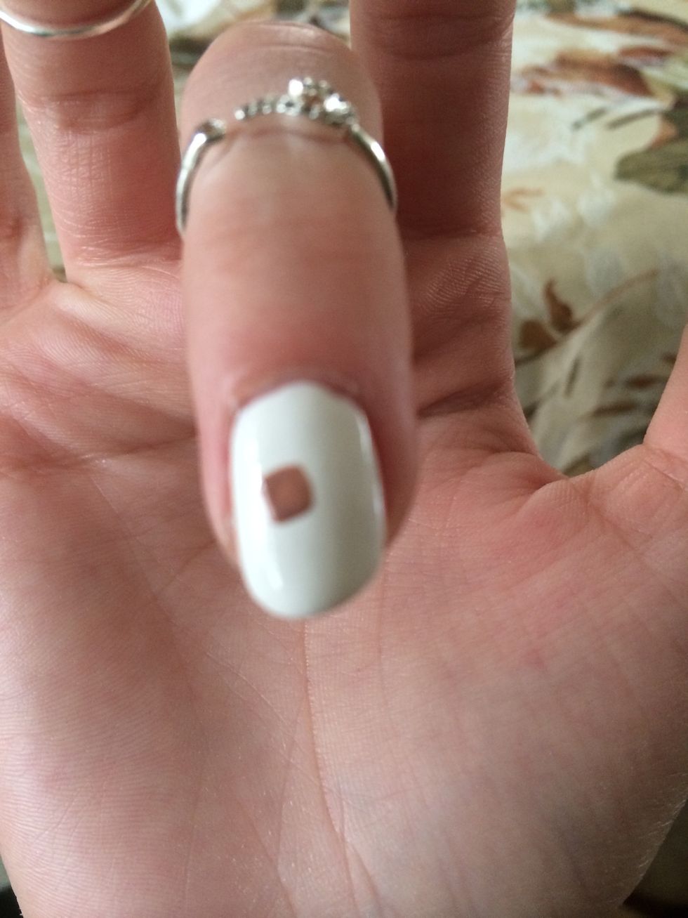 Middle finger is going to get a band aid on it. Start by creating a square in nude or light brown.