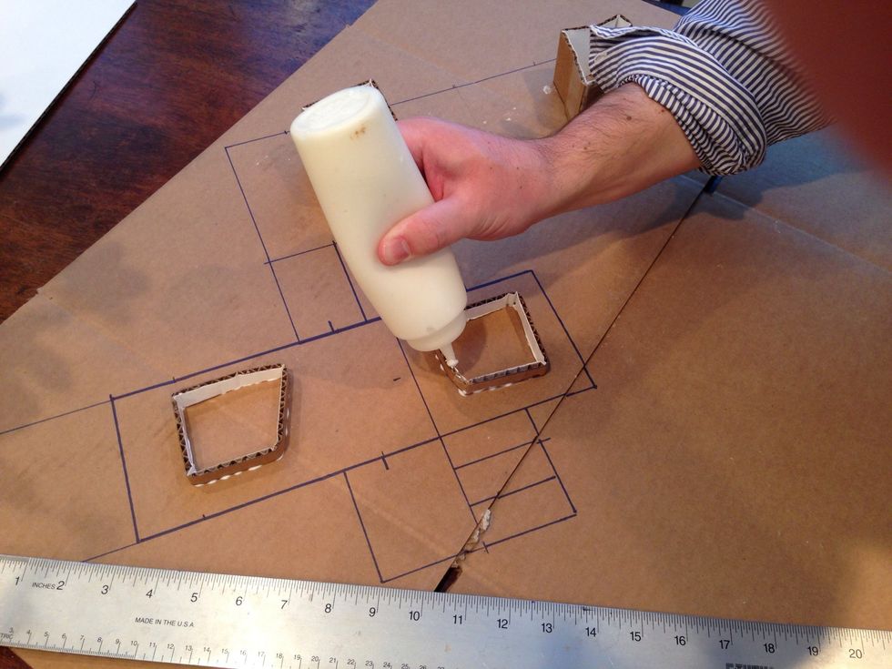 Mies held his house up with steel, but we only have candy canes. Here Throckmorton glues some cardboard together hold the floor off the base.