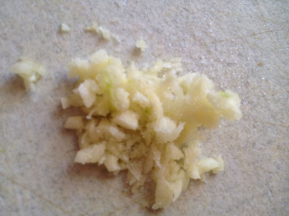 Mince and add salt to garlic.