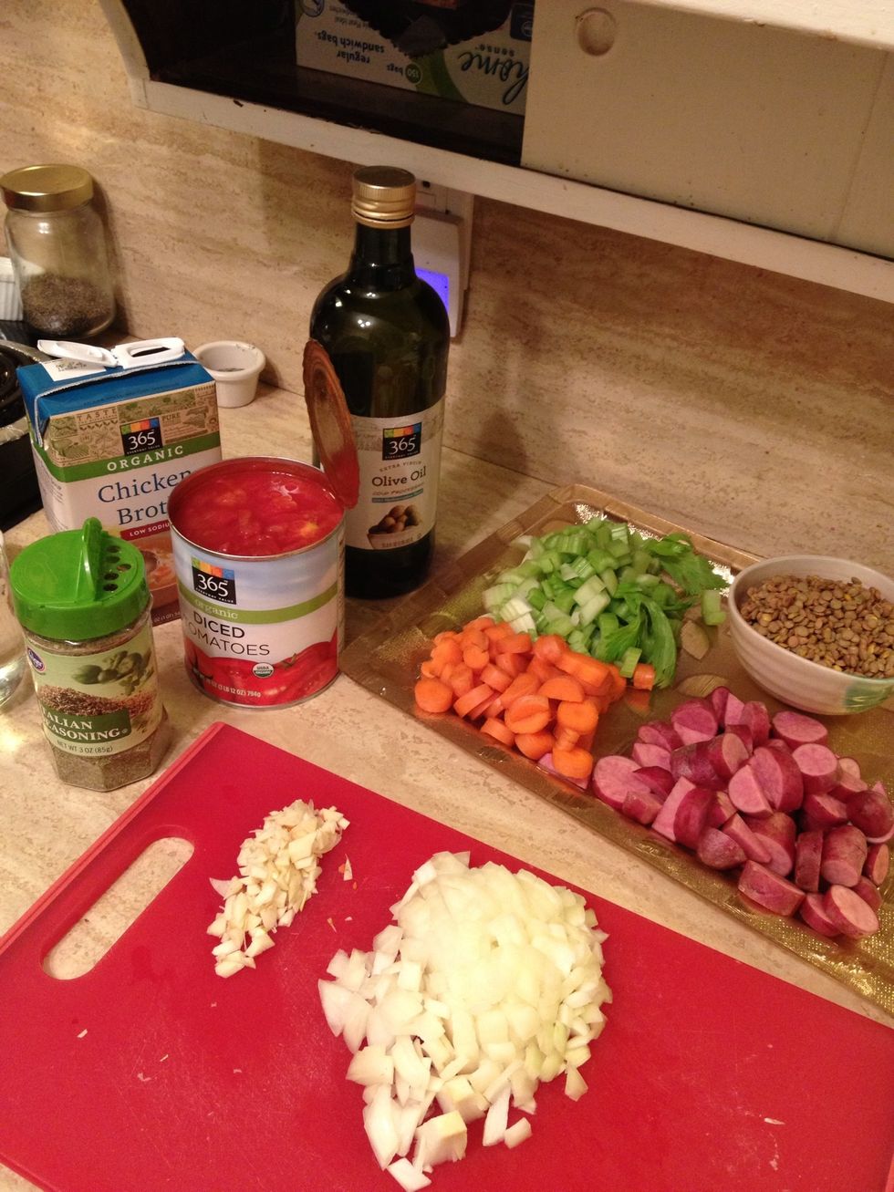 Mince/chop garlic, dice onion, and chop the celery/carrots/and potato to your liking. Go ahead and get the can opened and peel the opening of the chicken broth. Better than fumbling with it later.