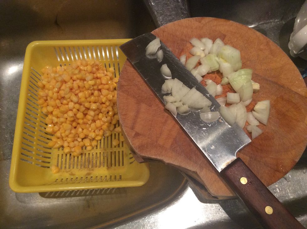 Mince some onions and ready the sweet corn