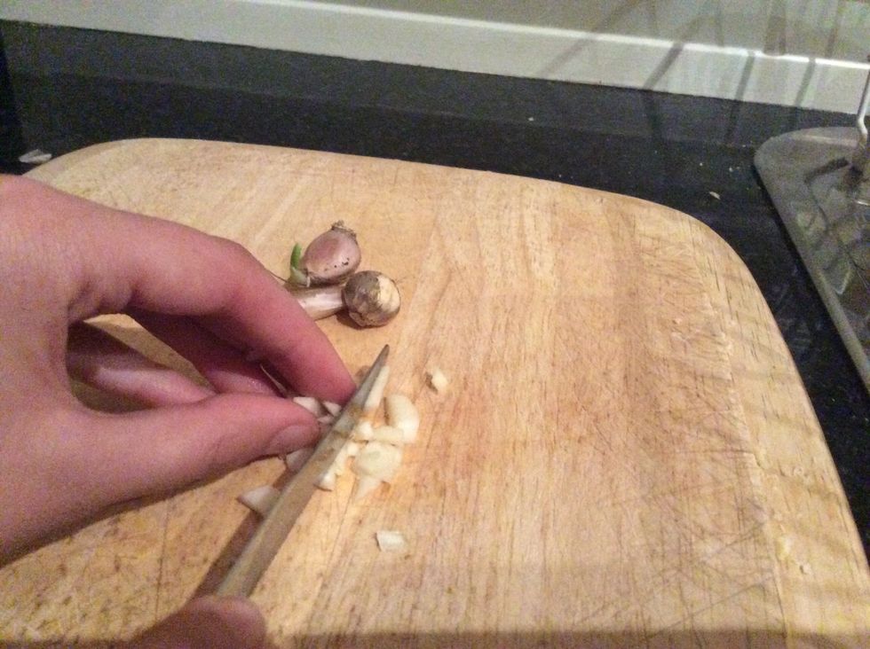 Mince up 4 cloves of garlic