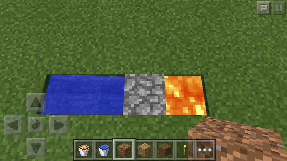 Mine the dirt block and cobblestone will appear!