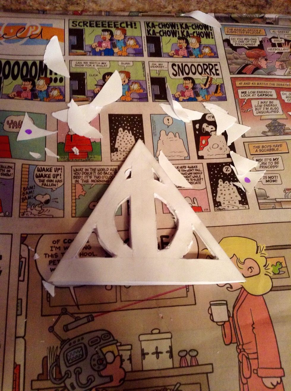 Mine wasn't cut the neatest, but it will still look good. Now, we unfold...