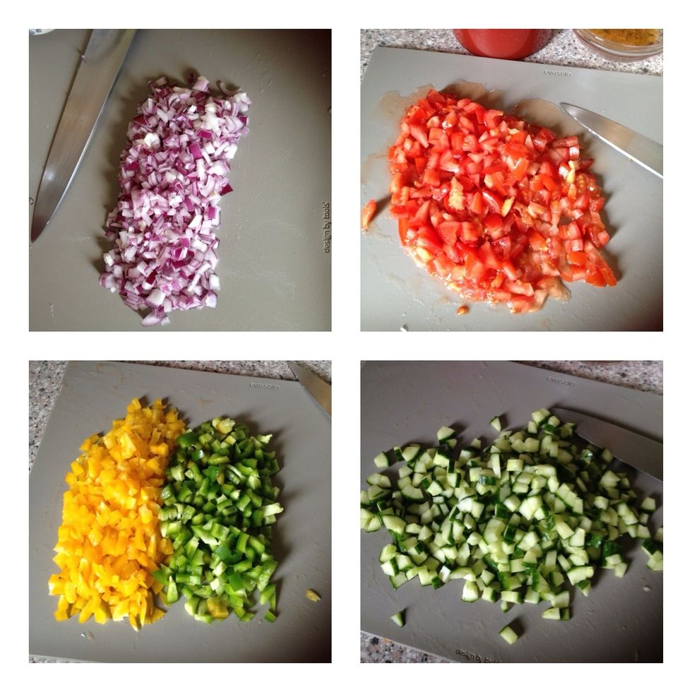 Mins the garlic and chop onions, tomatoes, peppers and cucumber into similar size cubes. Add finely chopped chilli if you want a bit of heat in your gazpacho.