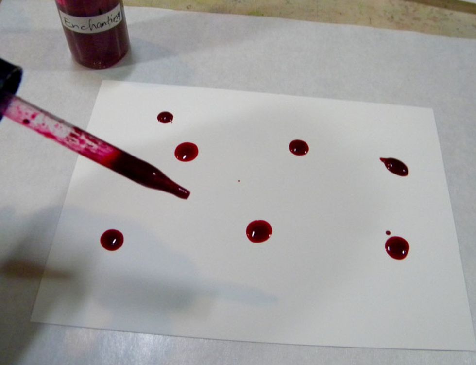 Minx Shimmering Inks come with a dropper. I started by dropping 6 or 7 drops of red Indulgence onto the Yupo paper. The inks will stain your hands so you may want to wear gloves.