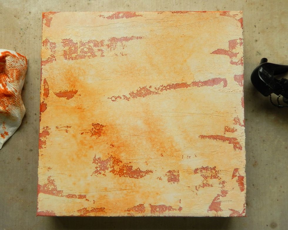 Mist the background with a little water and dab off some of the colour using a paper towel. Dry with a heat tool.