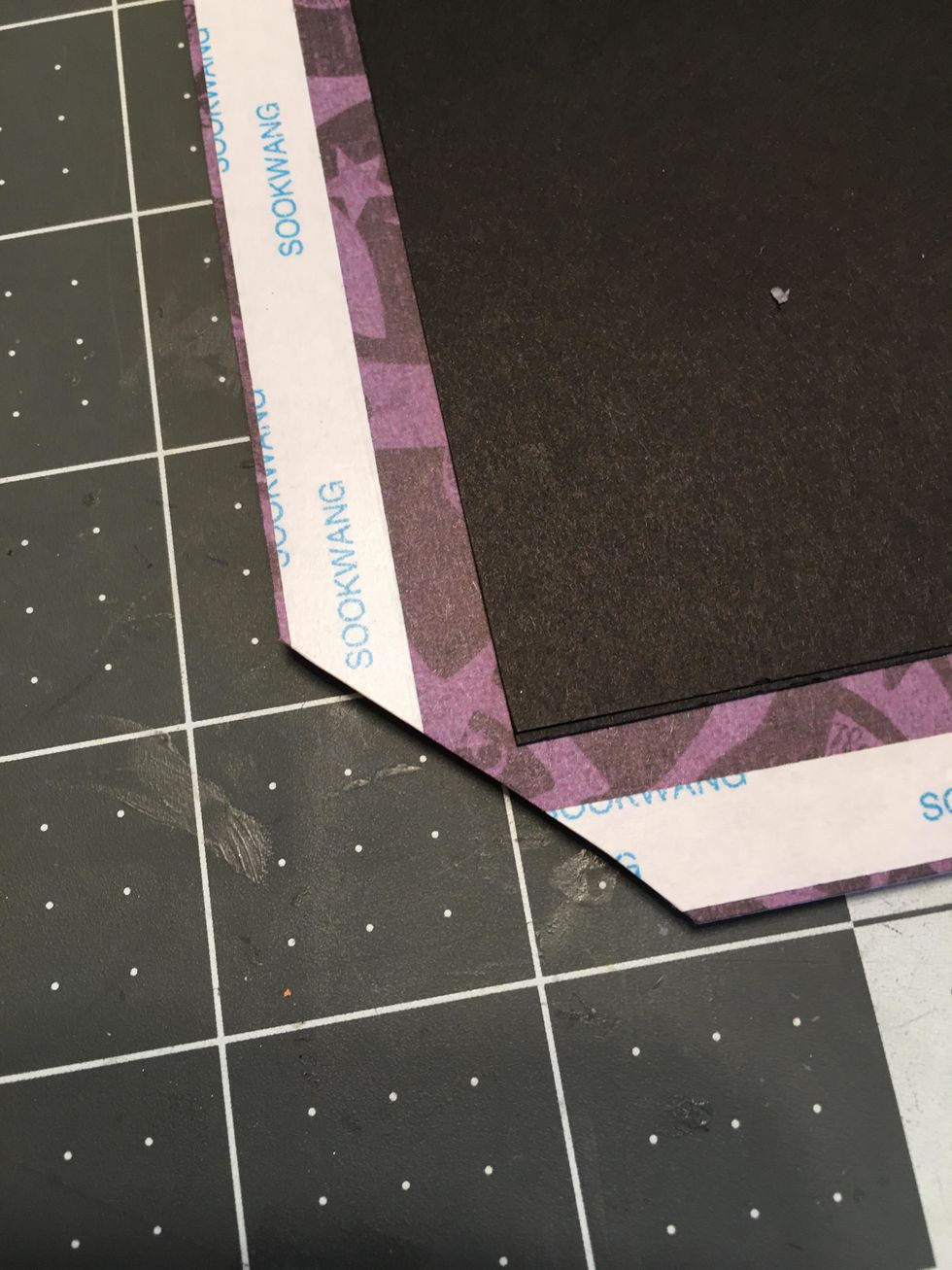 Miter cut all four corners of the paper as shown.  About 1/8" from the tip of the cardstock corners.