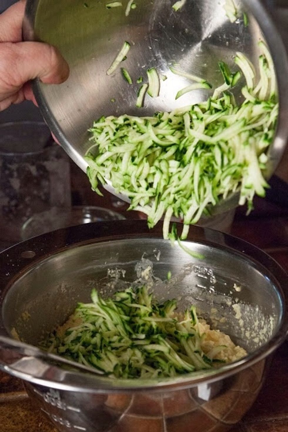 MIx 1 and 1/2 cup of shredded zucchini into the batter. Stir it all together.