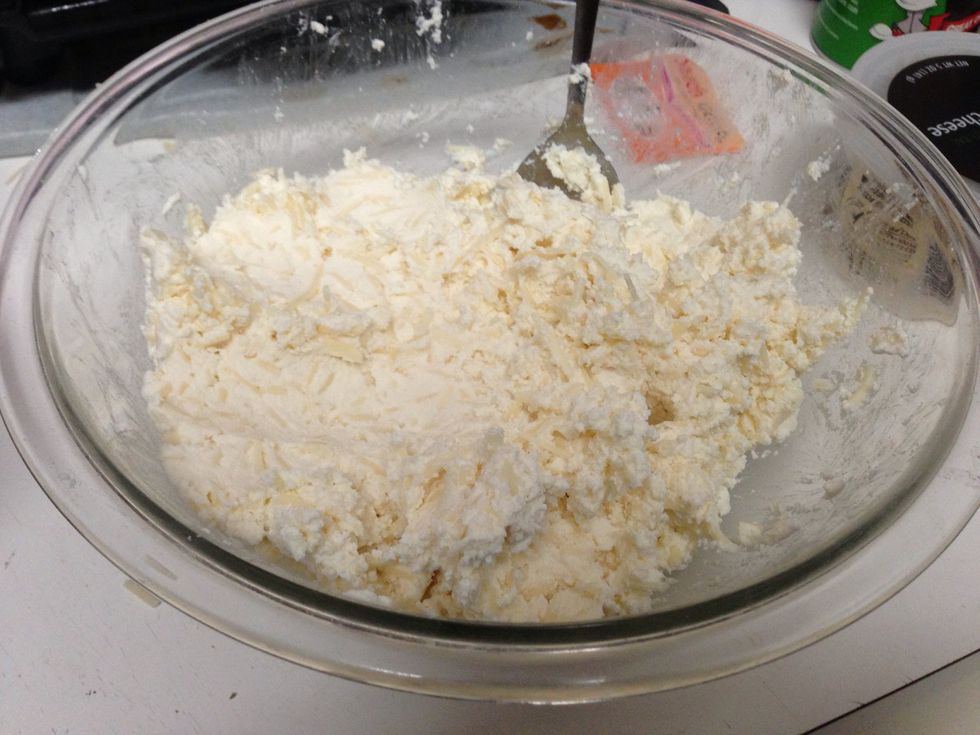 Mix 1 bag of the mozzarella cheese, ricotta and Parmesan together in a bowl.