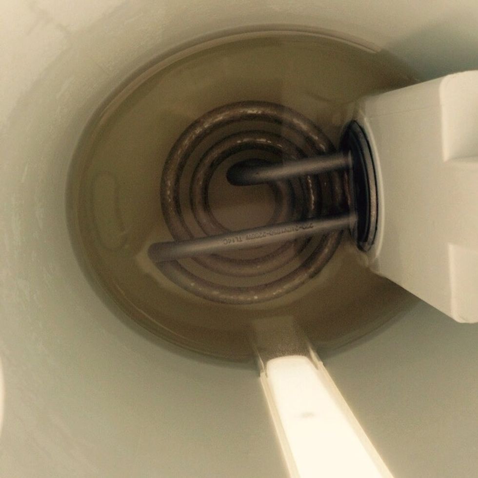 Mix 1part of white vinegar with 1part of water until you have enough to cover the wire entirely. You can use the same water you normally put here, the same one that generated that same limescale.