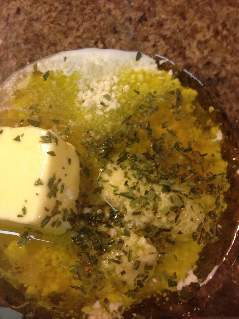 Mix: 2 tablespoon butter, 1/2 teaspoon chopped garlic, 1 tablespoon brandy, 1 tablespoon extra-virgin olive oil, 1/2 cup freshly grated Parmigiano-Reggiano,  Salt and freshly ground black pepper.