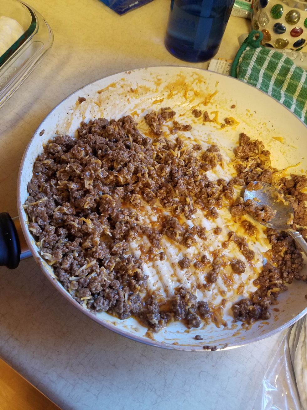 Mix 3/4 cup of enchilada sauce and 1 cup of shredded Colby Jack with the beef