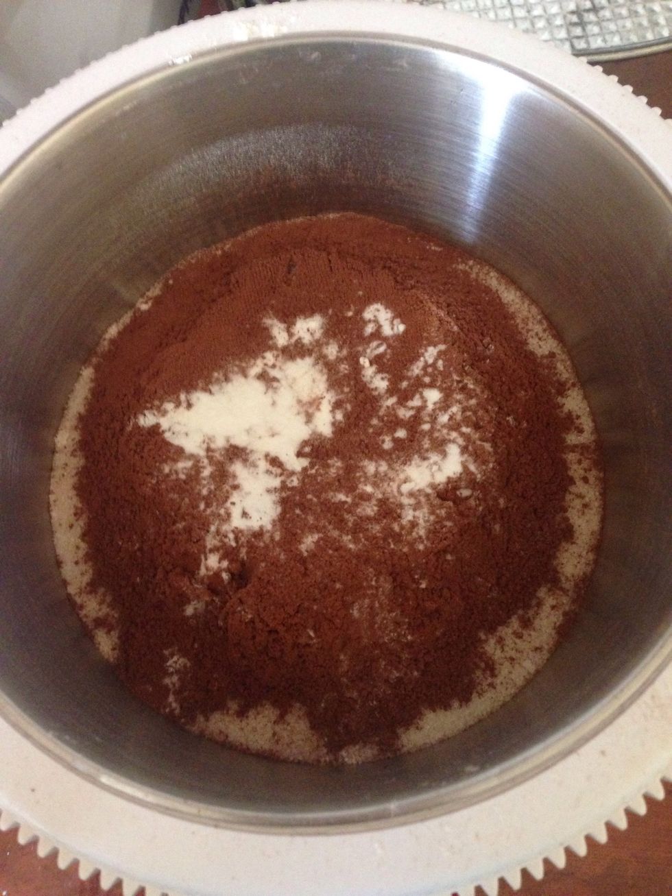 Mix 400g flour, 400g sugar, 55g Cocoa powder, 1 teaspoon baking soda 0.5 teaspoon vanilla and a pinch of salt