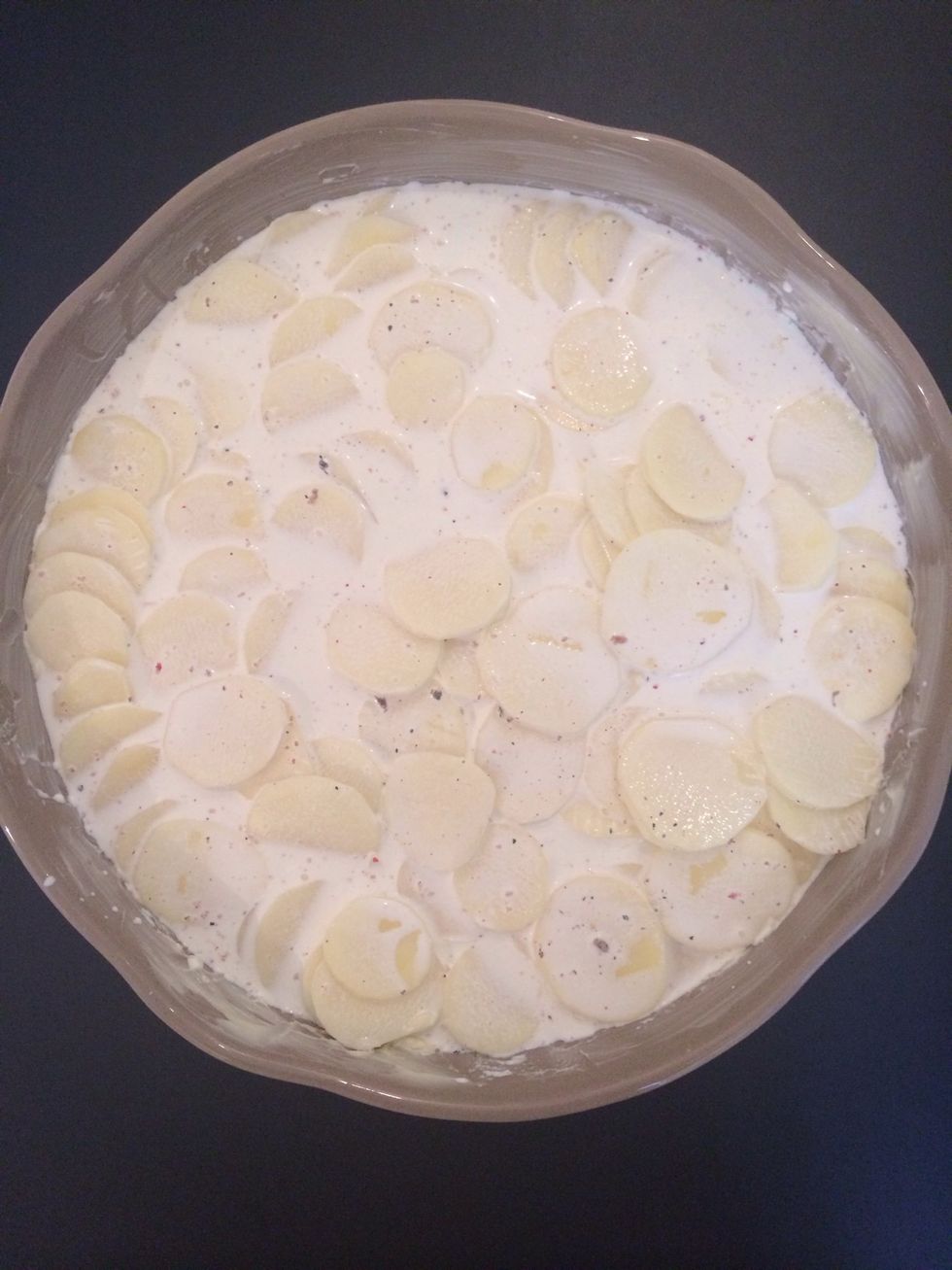 Mix 500 gm of double cream + nutmeg, salt and pepper. Put over the potatoes