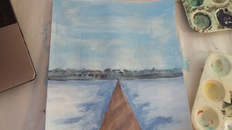 Mix a dark blue-grey for the background trees. Dab and dot these along the horizon line. These will not be very defined in the background.