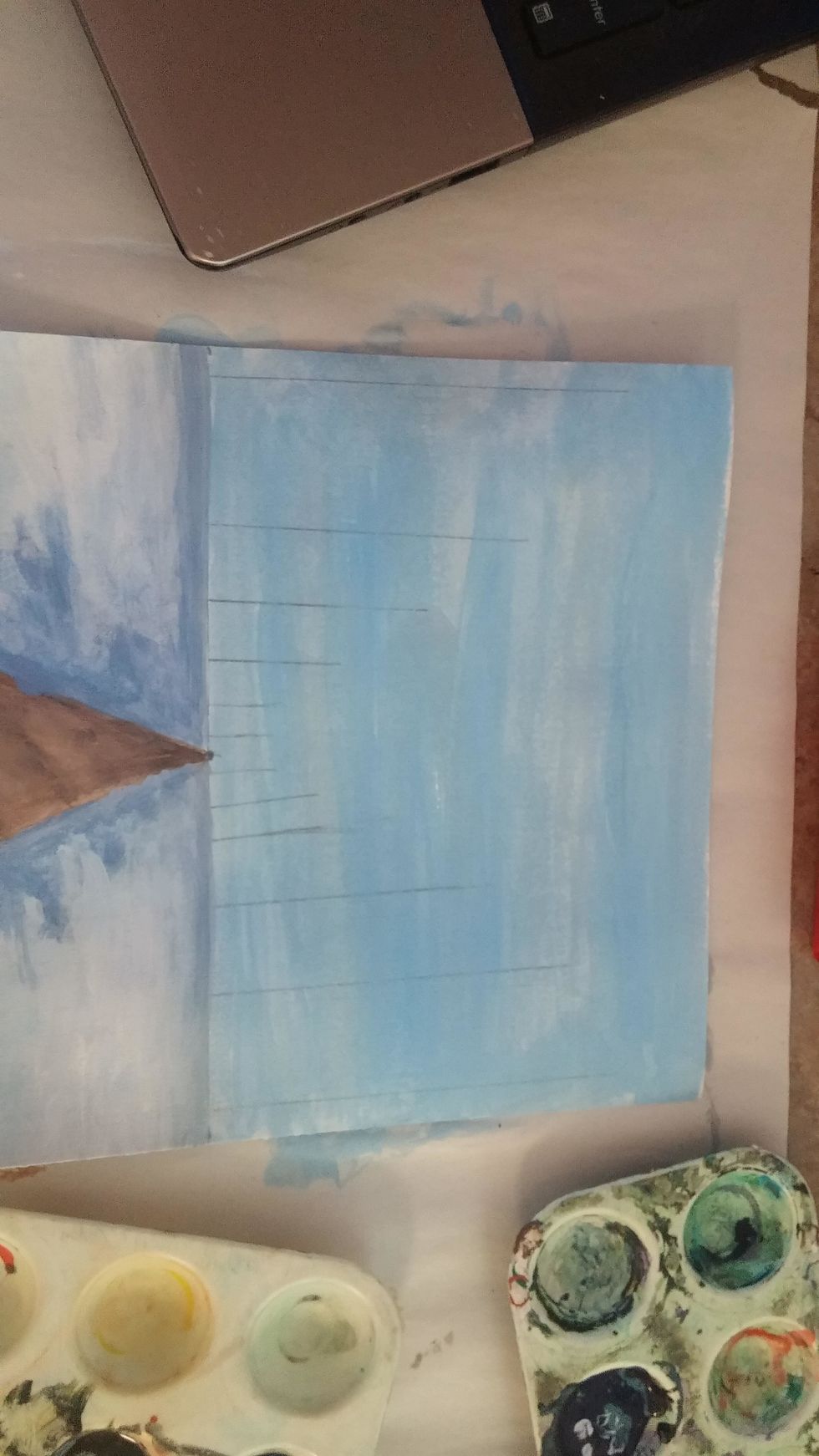 Mix a sky blue, depending on the time of the year. Cover entire sky area with this color.