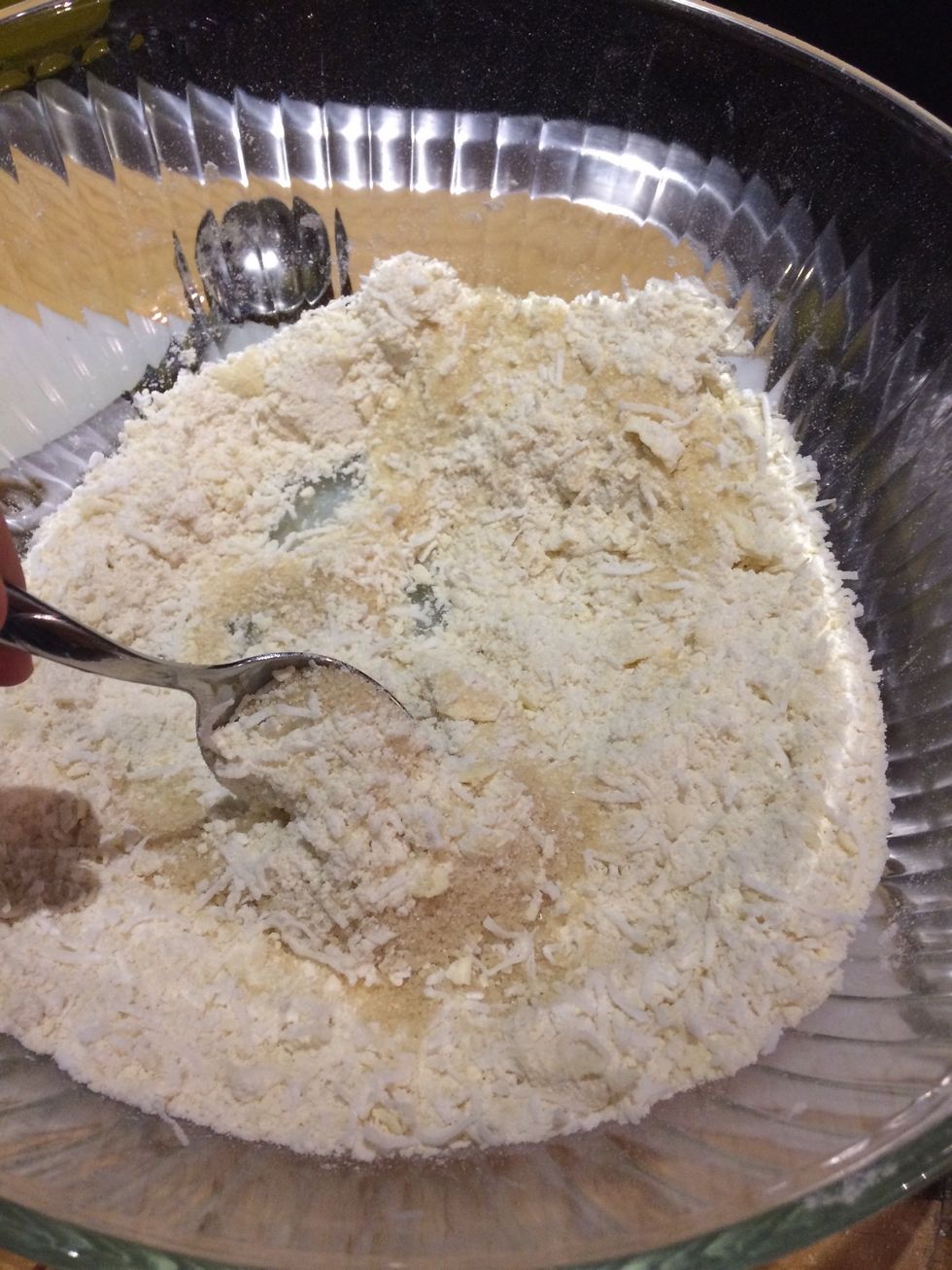 Mix all of the breadcrumbs, coconut and sugar until mixed through well