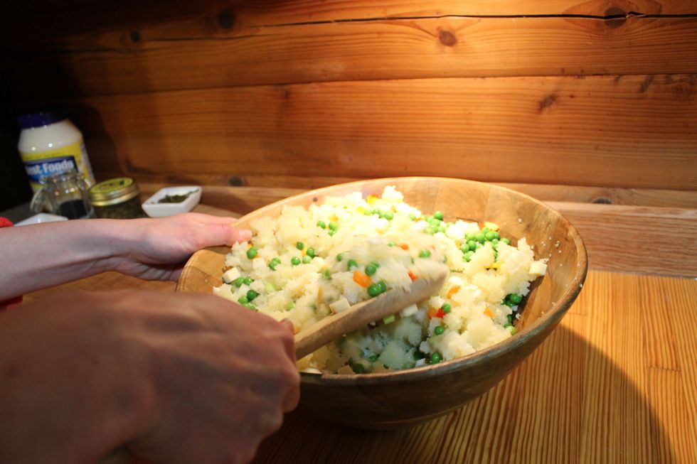 Mix all of your ingredients together with a large wooden spoon. Add mayonnaise to your desired consistency.