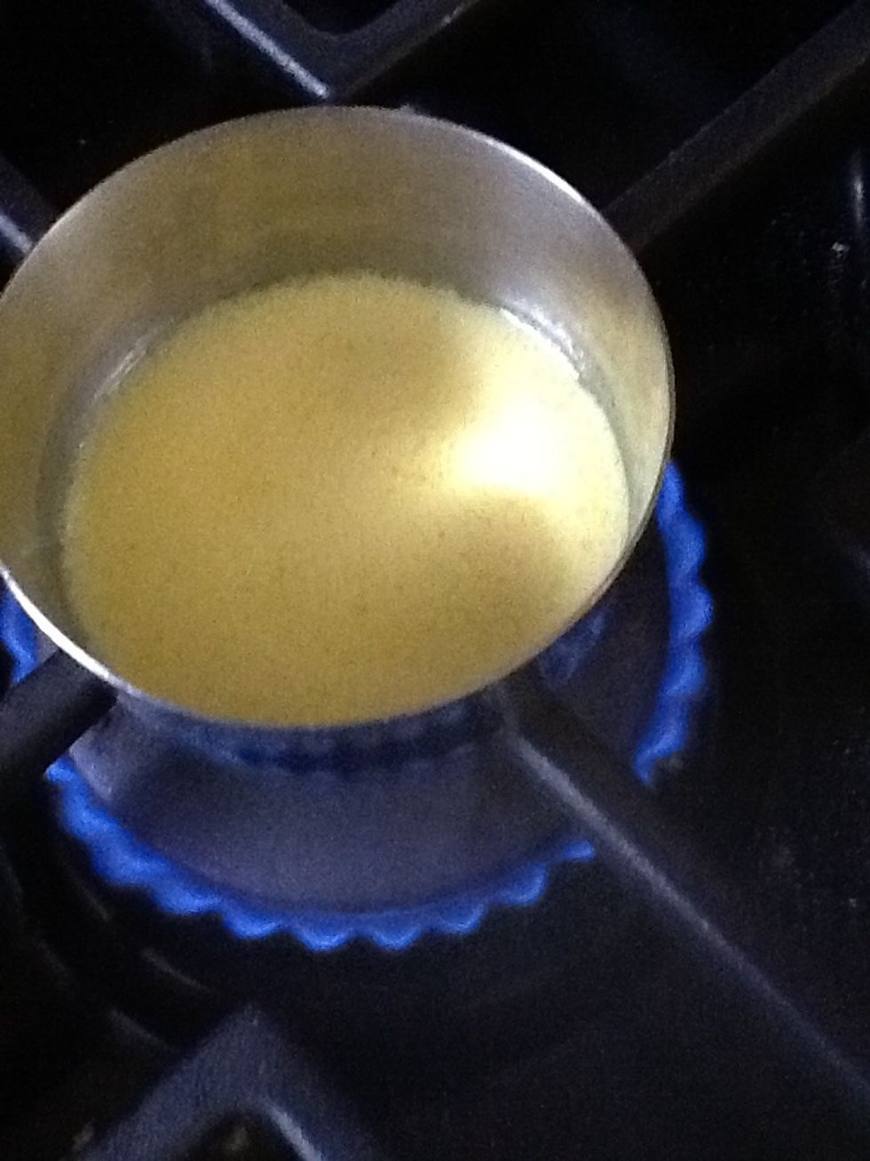 Mix all the ingredients. Heat over medium heat, stirring it once or twice. Heat till it's just about to rise