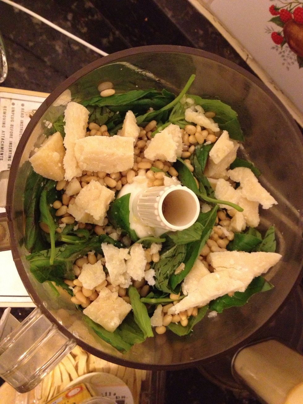 Mix all the ingredients in a blender and taste as you go along. I like to add lemon juice to my pesto. It's delicious!