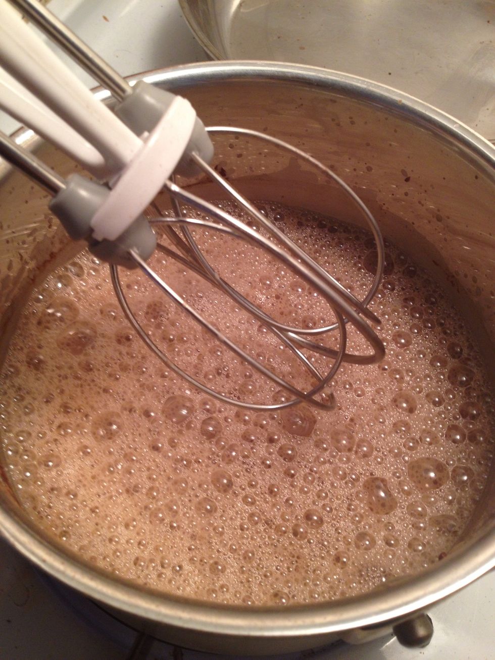 Mix all your ingredients together. I like to use an egg beater.  Note: At this point, you could totally drink this cold as chocolate milk.