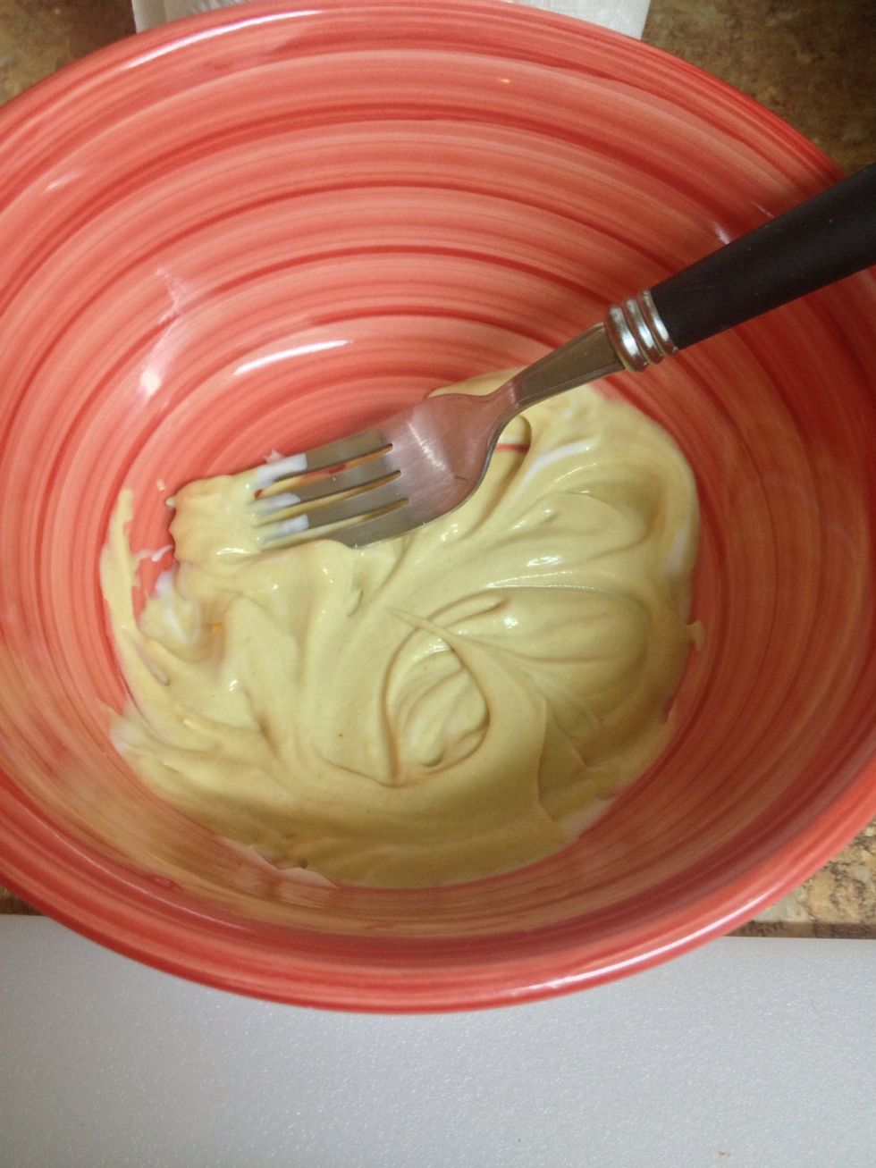 Mix an even amount of mayo and Dijon mustard in a bowl.