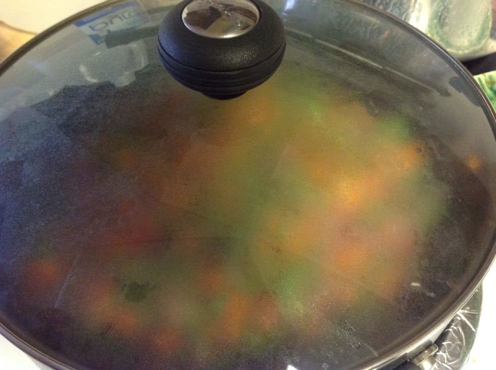 Mix and cover the pan with a lid for about a minute..